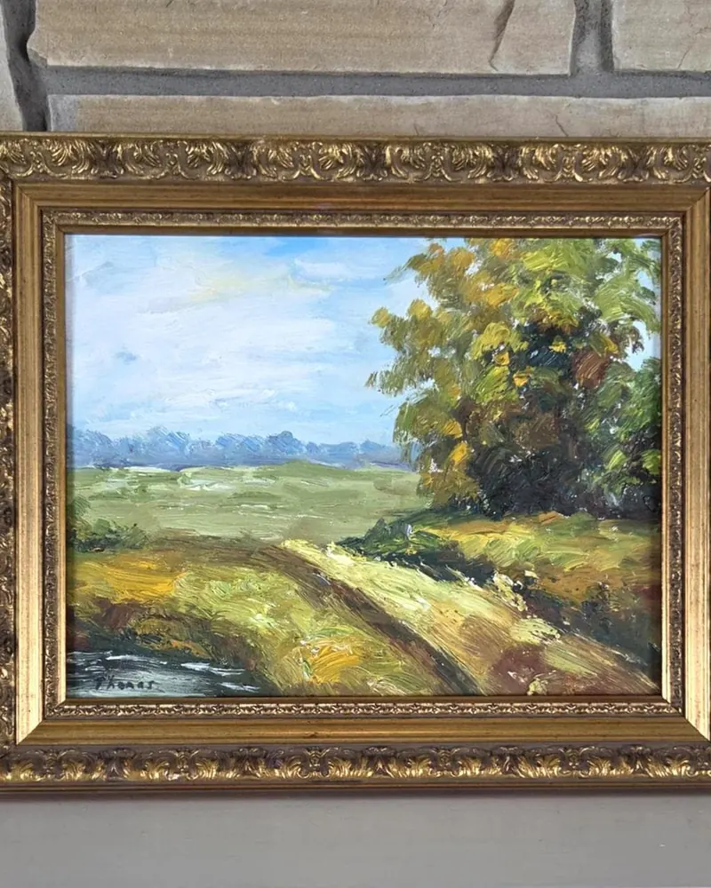 Quadro de paisagem com moldura dourada